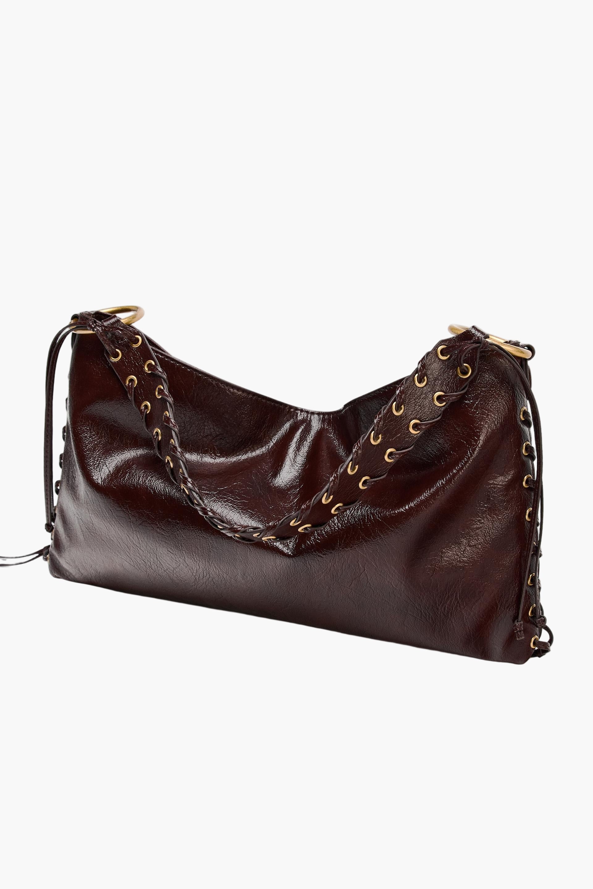 Side view of brown vegan leather shoulder bag with braided handle