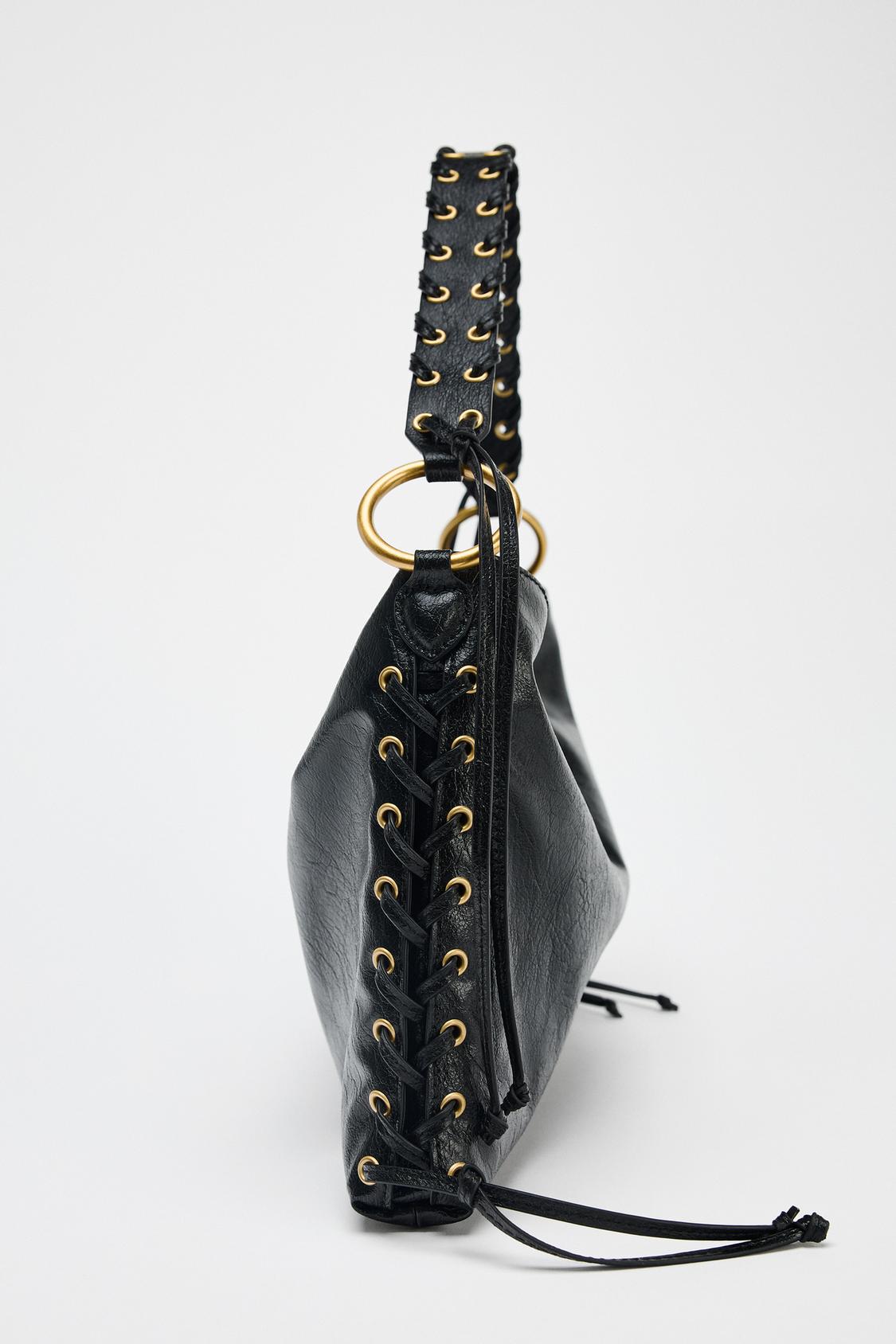 Close-up of braided handle and gold ring hardware – vegan leather finish