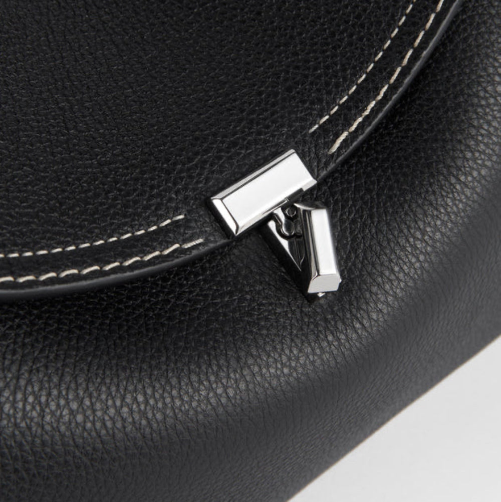 gold lock closure arc flap structured handbag detail women