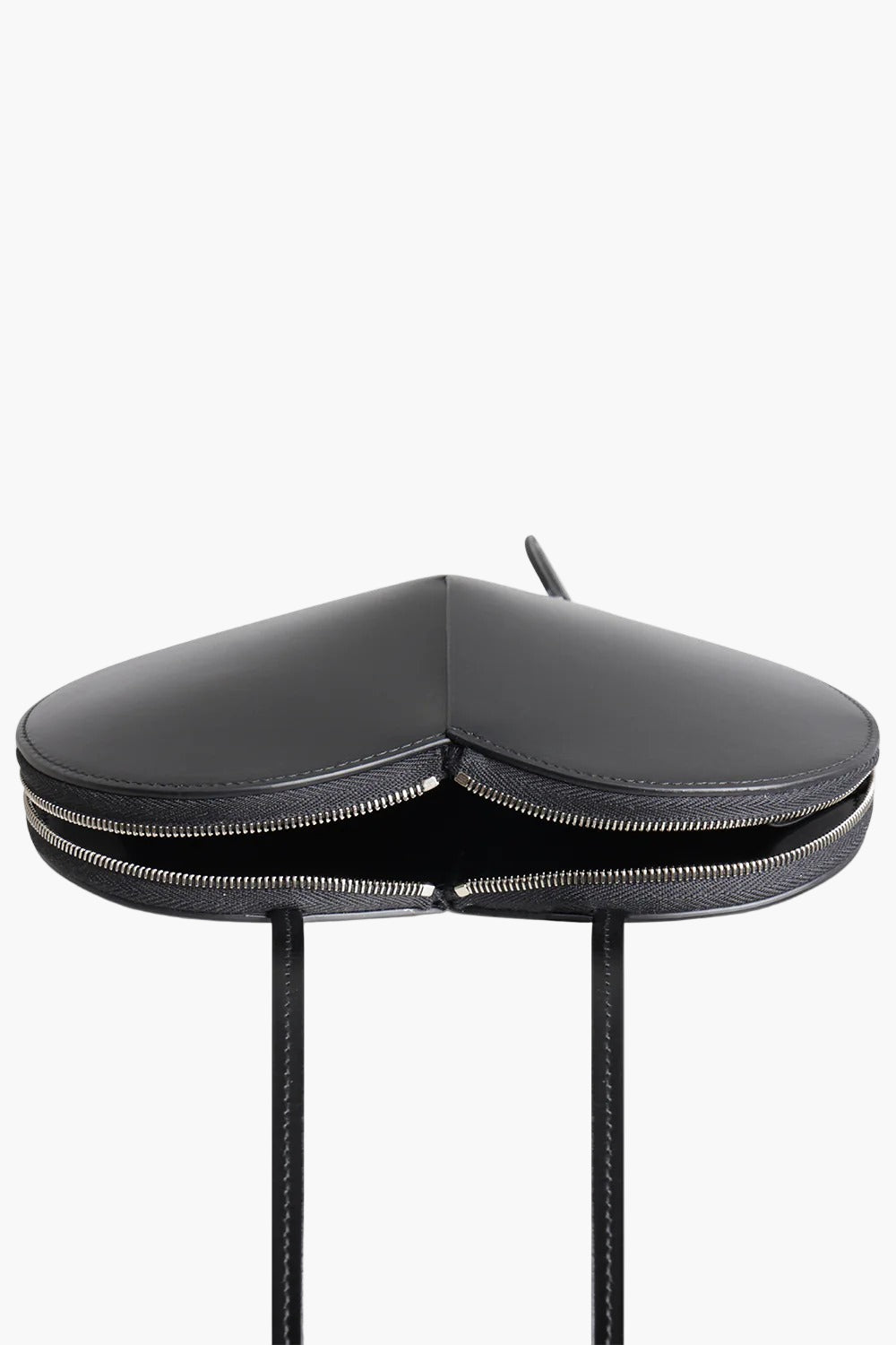 heart shaped bag black flat lay women leather sculptural