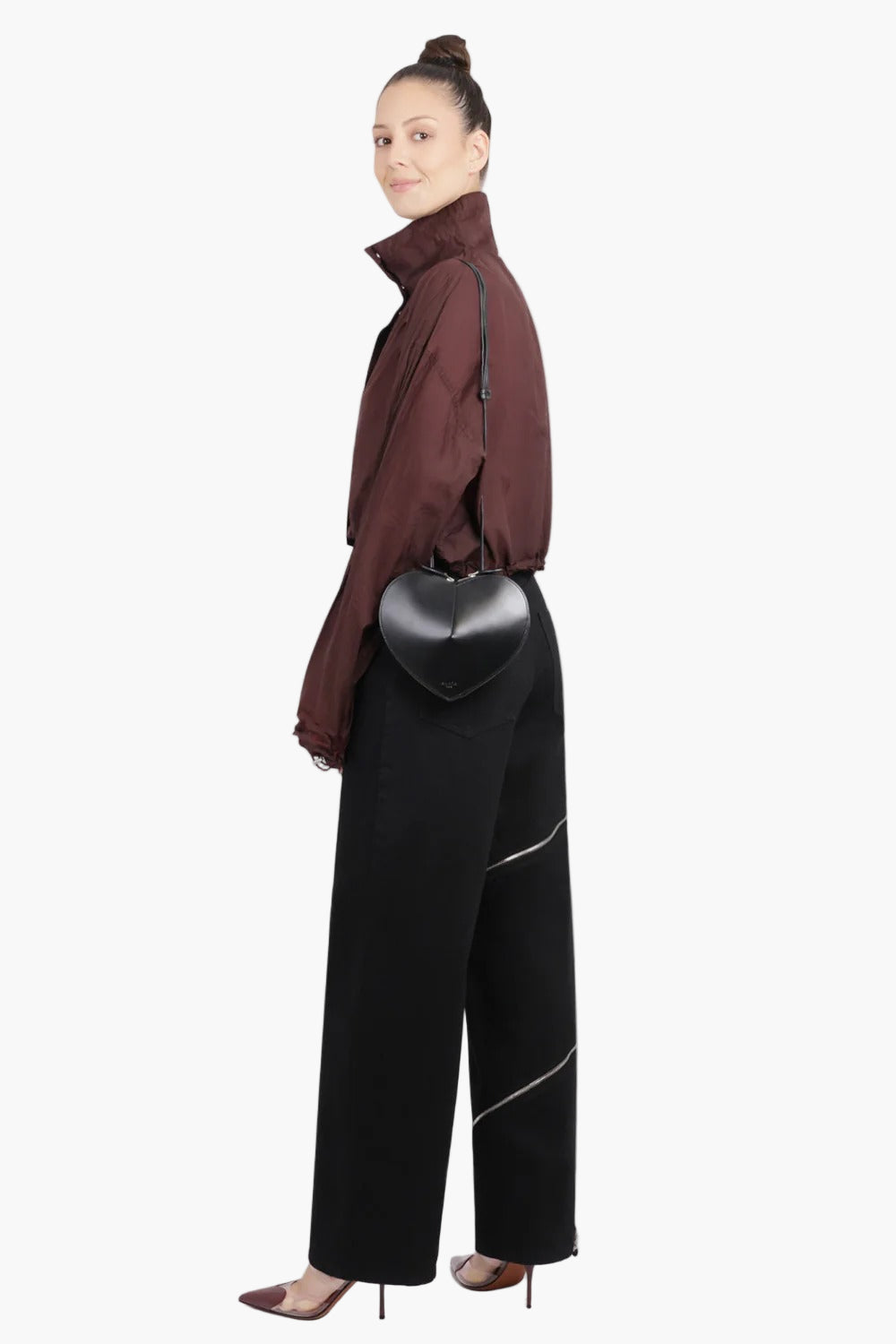 women wearing black heart shaped bag crossbody street style elegant