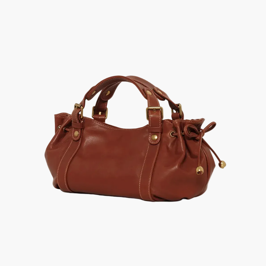 Brown leather handbag with drawstring on the side 