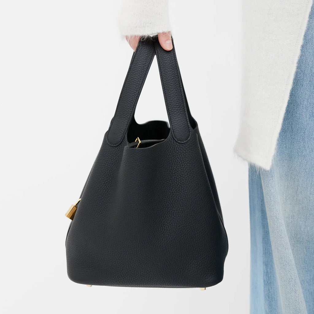 women full length black bucket bag gold padlock street style