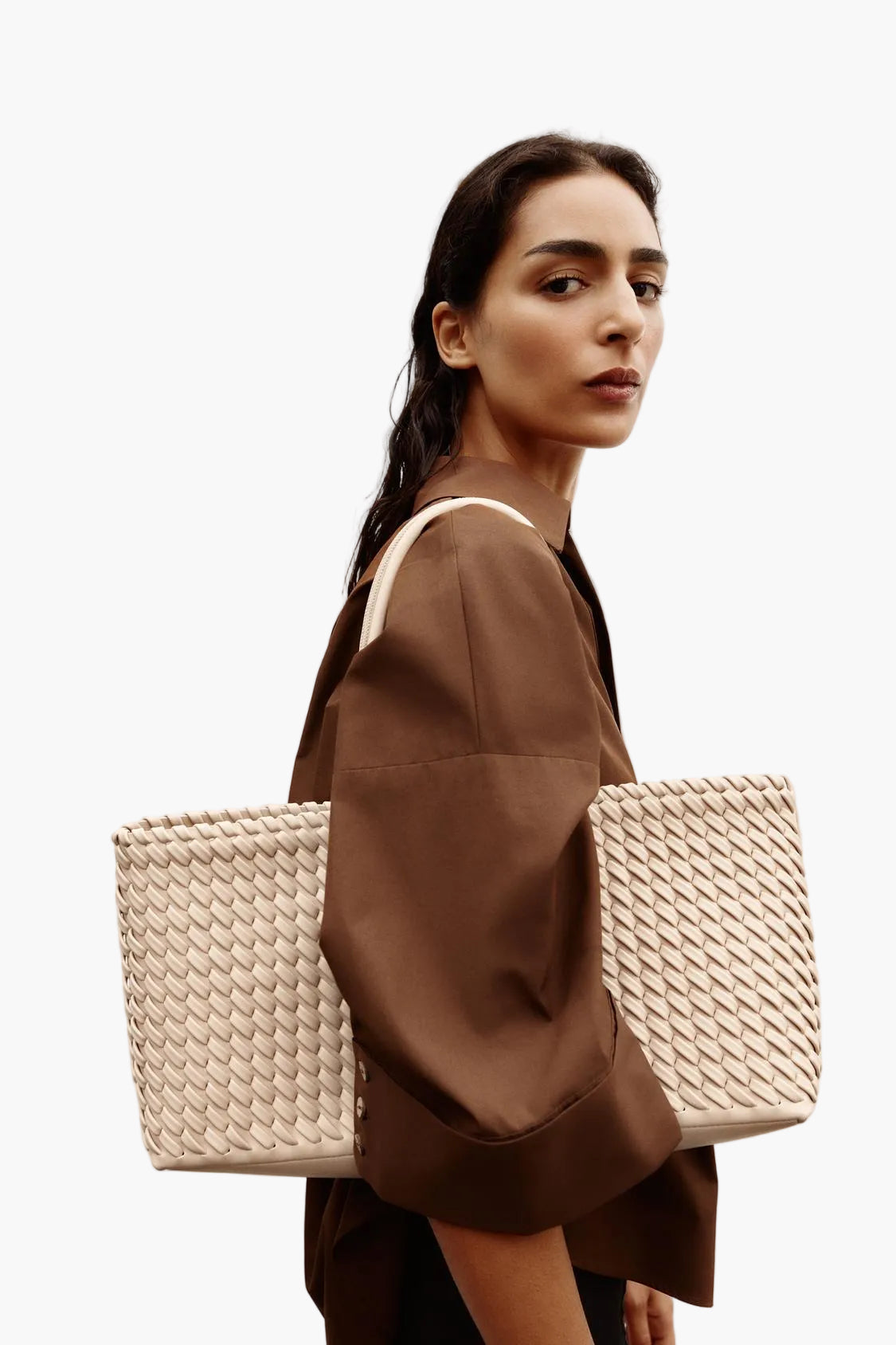 women wearing woven leather tote bag ecru cream street style elegant